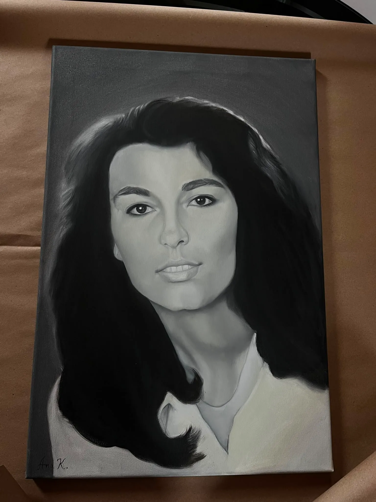 Black and white oil portrait of a woman with long dark hair, painted by Ana Kovač